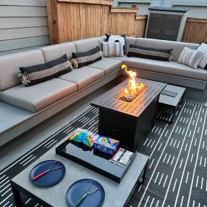 Photo of outdoor seating in front of a fire pit. 
